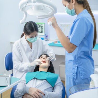 Riverdale dentist doing tooth extraction to their patient