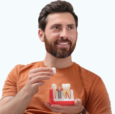 Men holding dental implant model of East York dental clinic